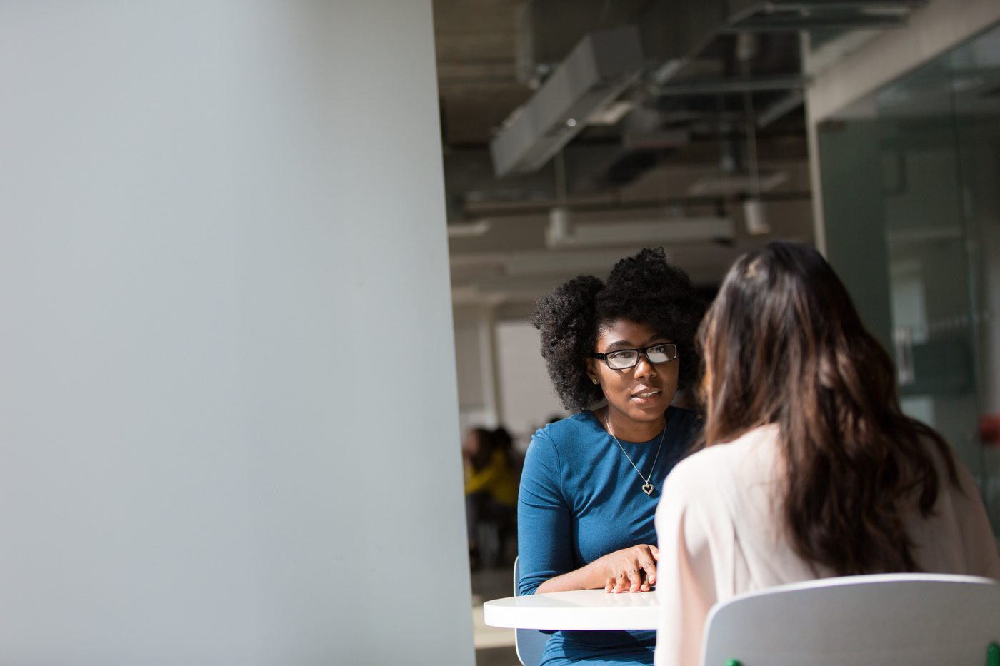 Two women in conversation during a Women of Strength session