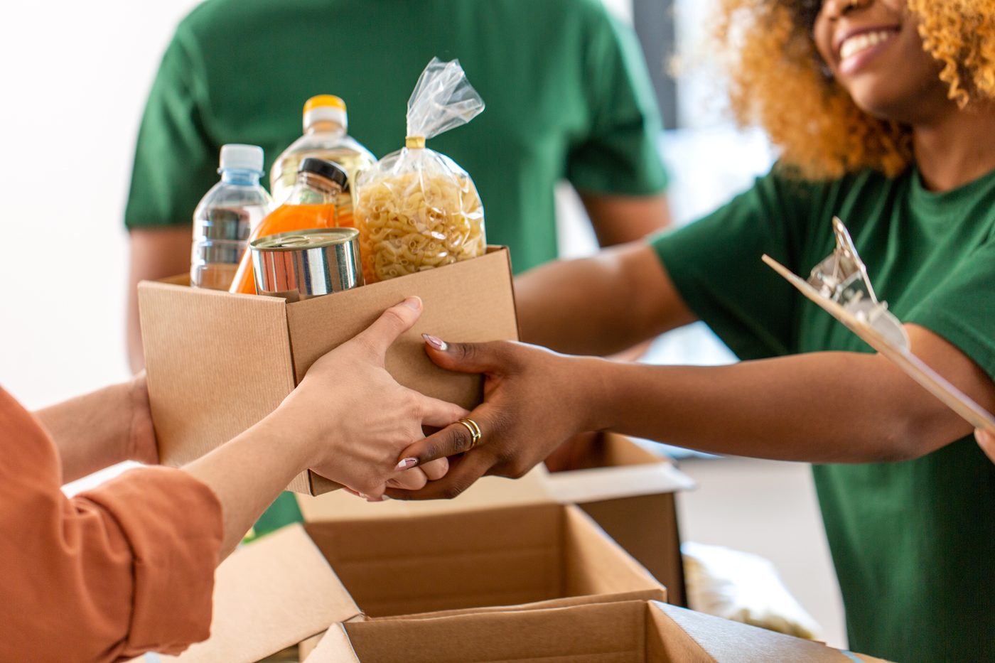 Volunteers packing groceries for families in the community